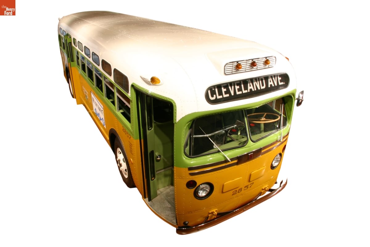 Lime green and mustard yellow bus with white roof; "Cleveland Ave" in destination window on front