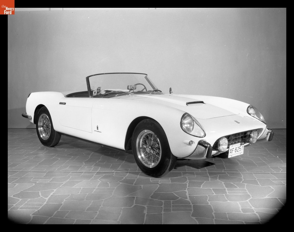 Black-and-white photo of sleek light-colored convertible sportscar