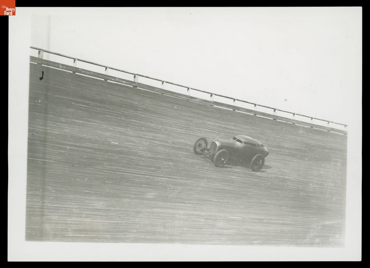 Barney Oldfield Driving "Golden Submarine" Race Car at Sheepshead Bay Board Track, Brooklyn, New York, 1917 Race car on steeply tilted wood track