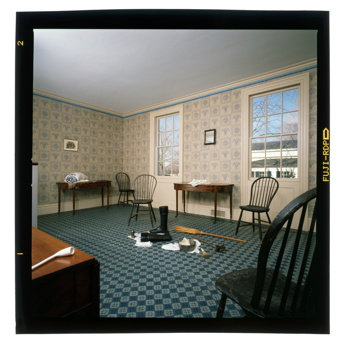 Dining Room in Noah Webster Home, Greenfield Village, February 1989 Mostly empty room with patterned floor and wallpaper, containing a few chairs and side tables