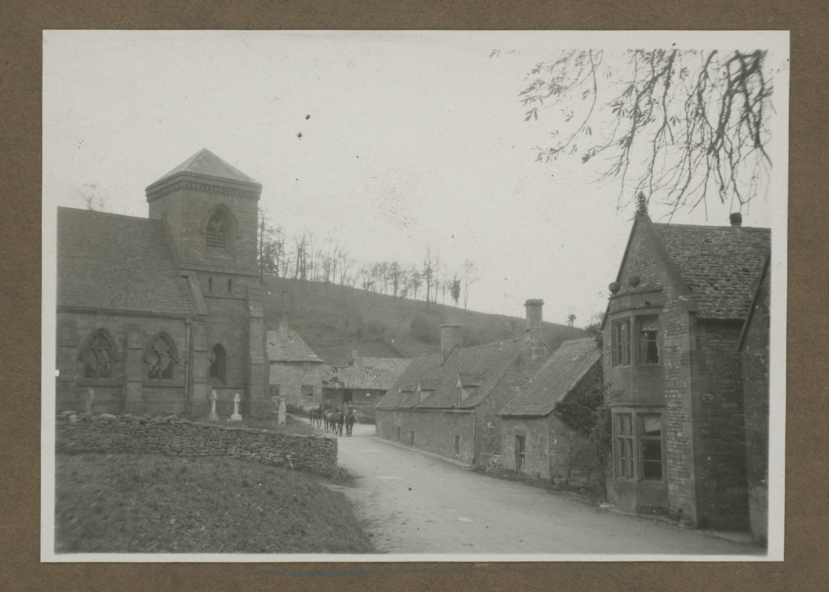 Photograph Album, Henry and Clara Ford's Visit to the Cotswolds, October 1930 / page 8 Road running between stone buildings with stone walls