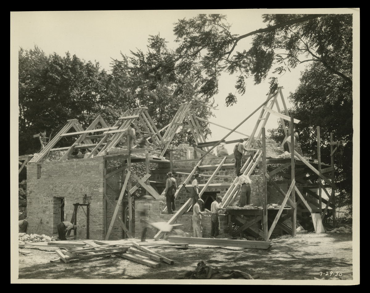 Rebuilding Cotswold Cottage in Greenfield Village, July 1930 Workers on a partially constructed building