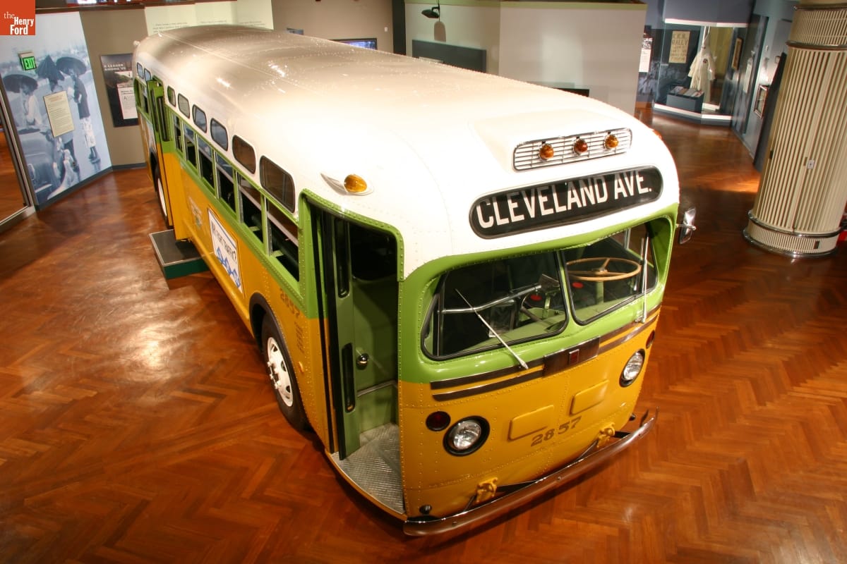 Yellow and lime green bus with white roof