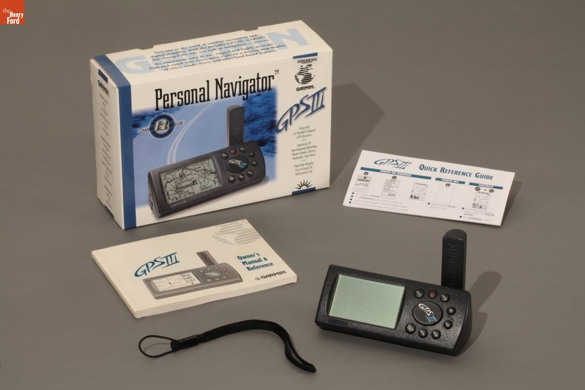 Small electronic device, cord, instruction manual, "quick reference guide," and box for GPS system