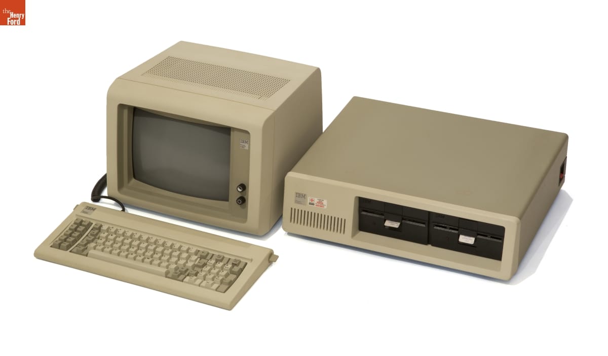 Horizontal computer processor with two disk drives, monitor, and keyboard