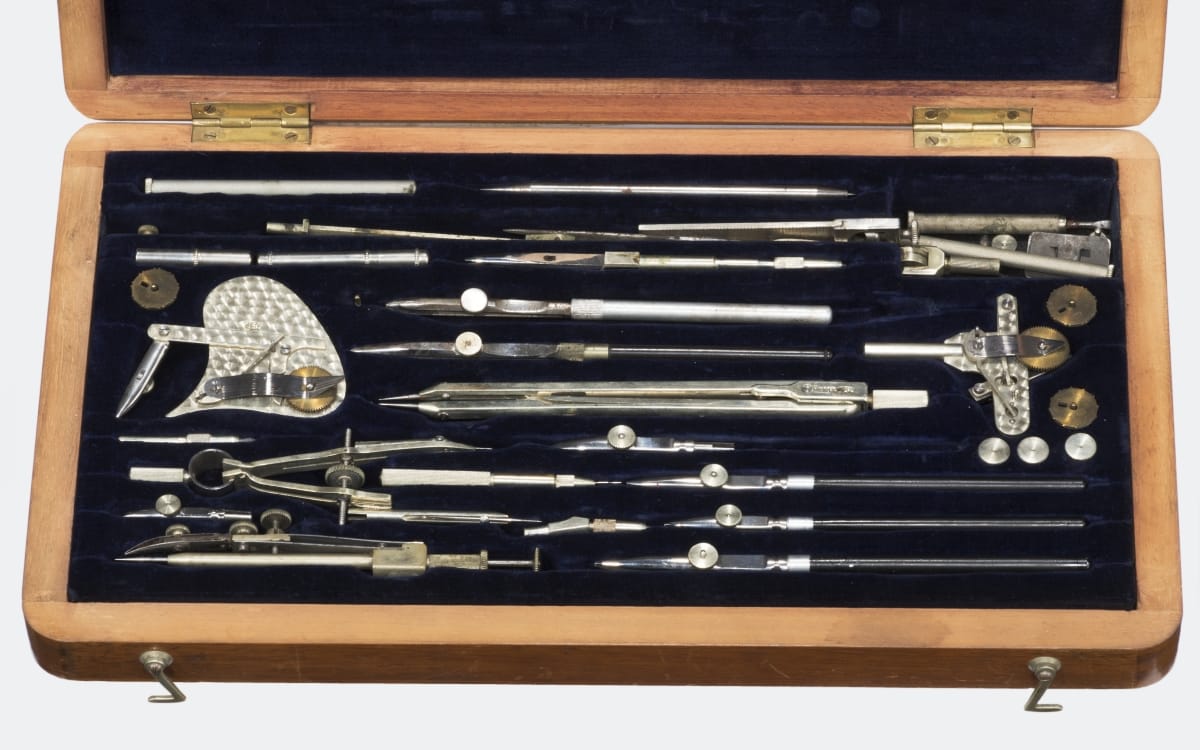 Set of "Pracision" Drafting Tools, Used by Leo Goossen, 1925-1941 Wooden case open to reveal a number of silver drafting tools inside, set in black velvet