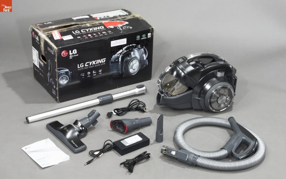 LG Electronics Compact wheeled vacuum pictured with a box and many accessories