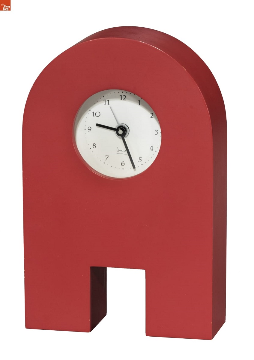 Arch-shaped red clock with small face in center