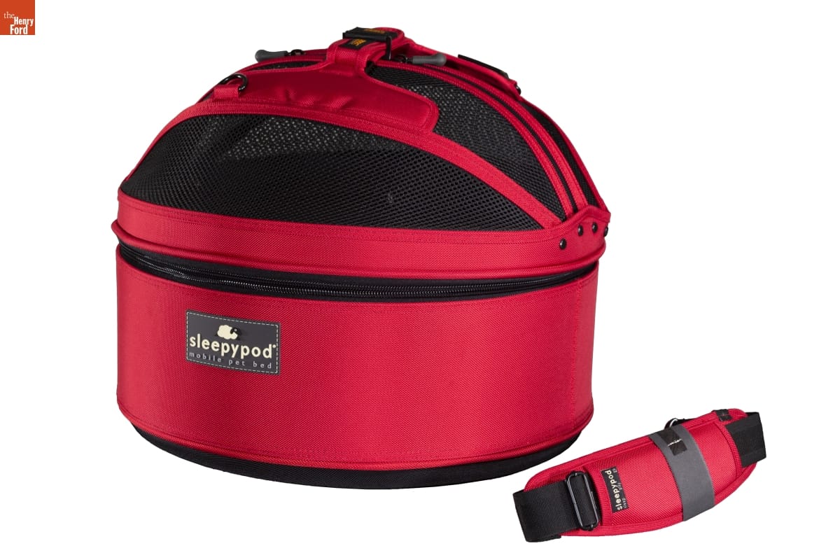 Sleepypod Pet Carrier, 2019 Red fabric carrier with domed black mesh top; handle (?) laying nearby