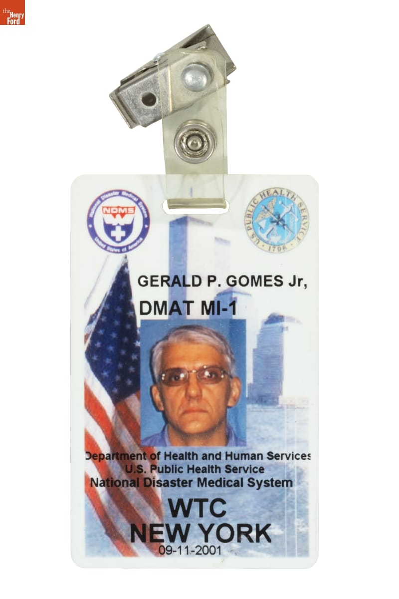 Rectangular badge with images of man's face, American flag, buildings, small logos, and text