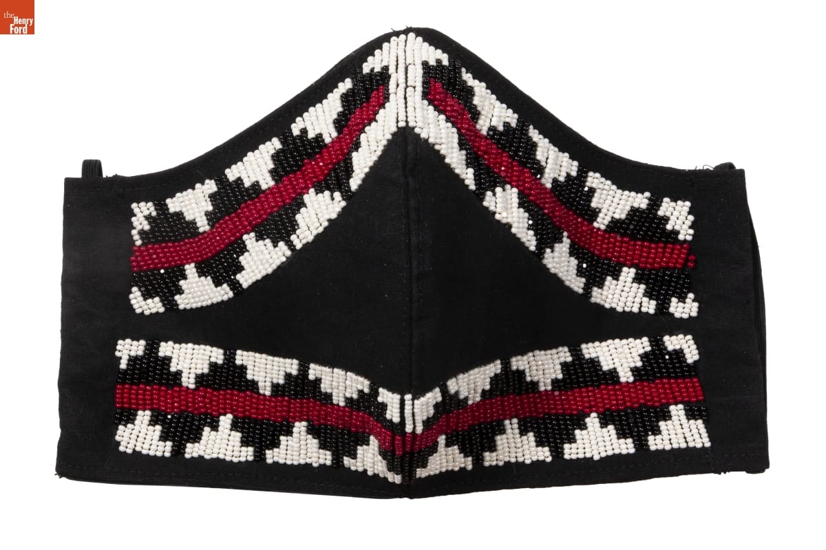 Beaded Face Mask, Made by Brighid "Birdie" Pulskamp, September 2020 Black fabric face mask with pattern of white, black, and red beads around border