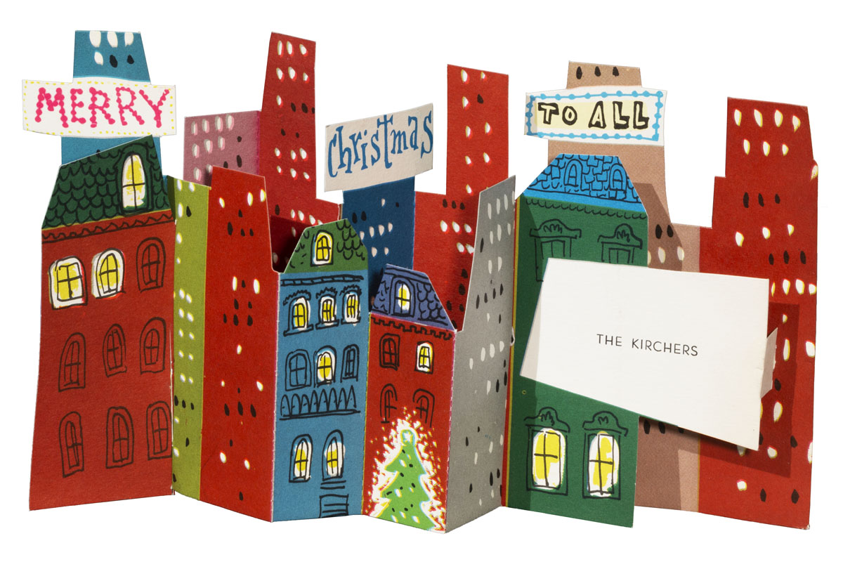 Three-dimensional Christmas card with a cityscape of buildings, a Christmas tree, and banners with text