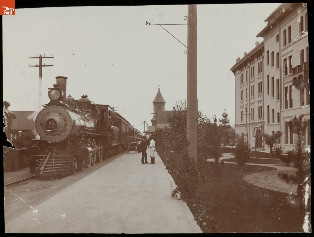 Passenger Train at a Railroad Station, circa 1910