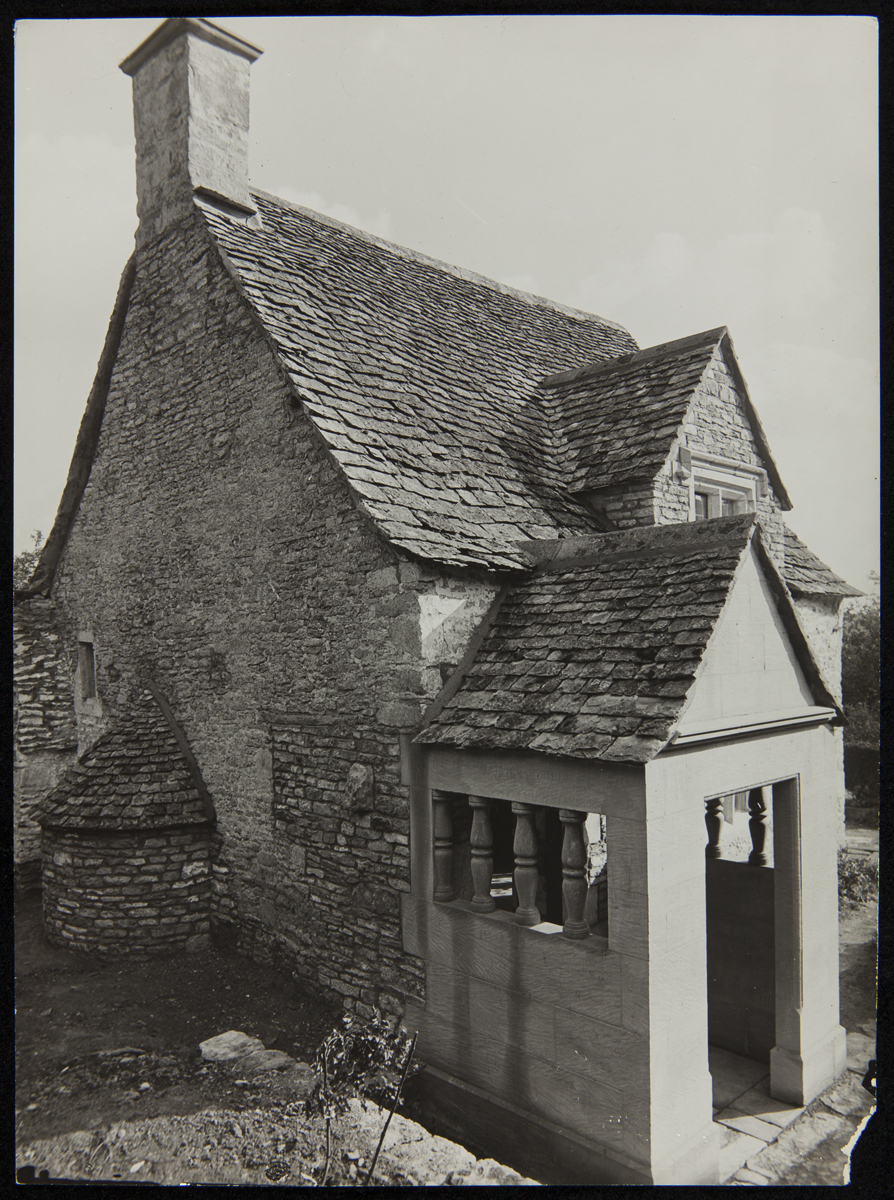 Exterior of Cotswold Cottage at its Original Site, Chedworth, Gloucestershire, England, 1929-1930 Stone house with porch