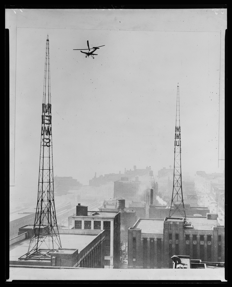 Aircraft flying over towers and buildings