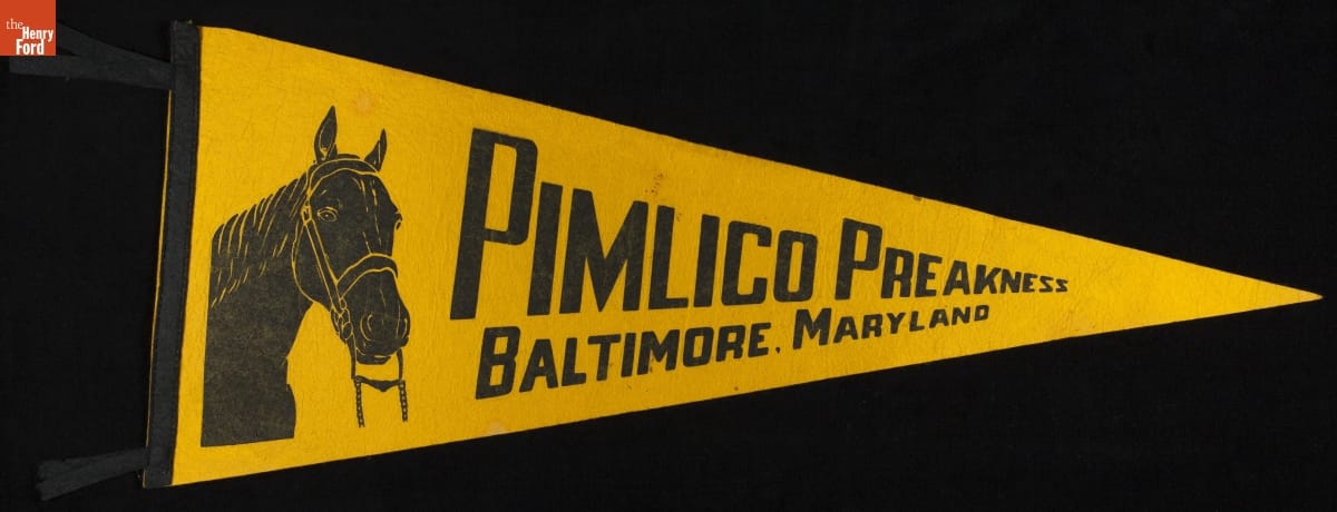 Triangular yellow pennant with portrait of horse and text