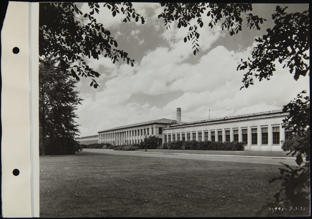 Ford Engineering Laboratory, July 1936 Black-and-white photo of long, low building across a grassy lawn