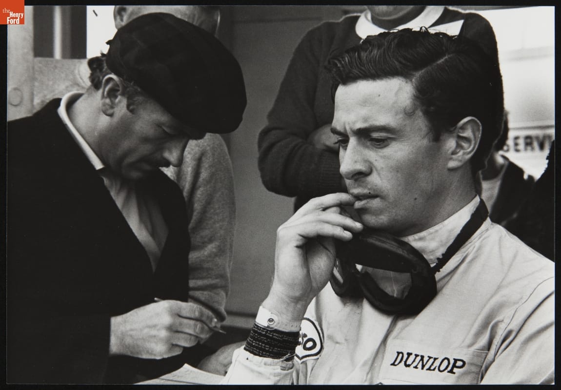 Colin Chapman and Driver Jimmy Clark at the 1965 U.S. Grand Prix at Watkins Glen.