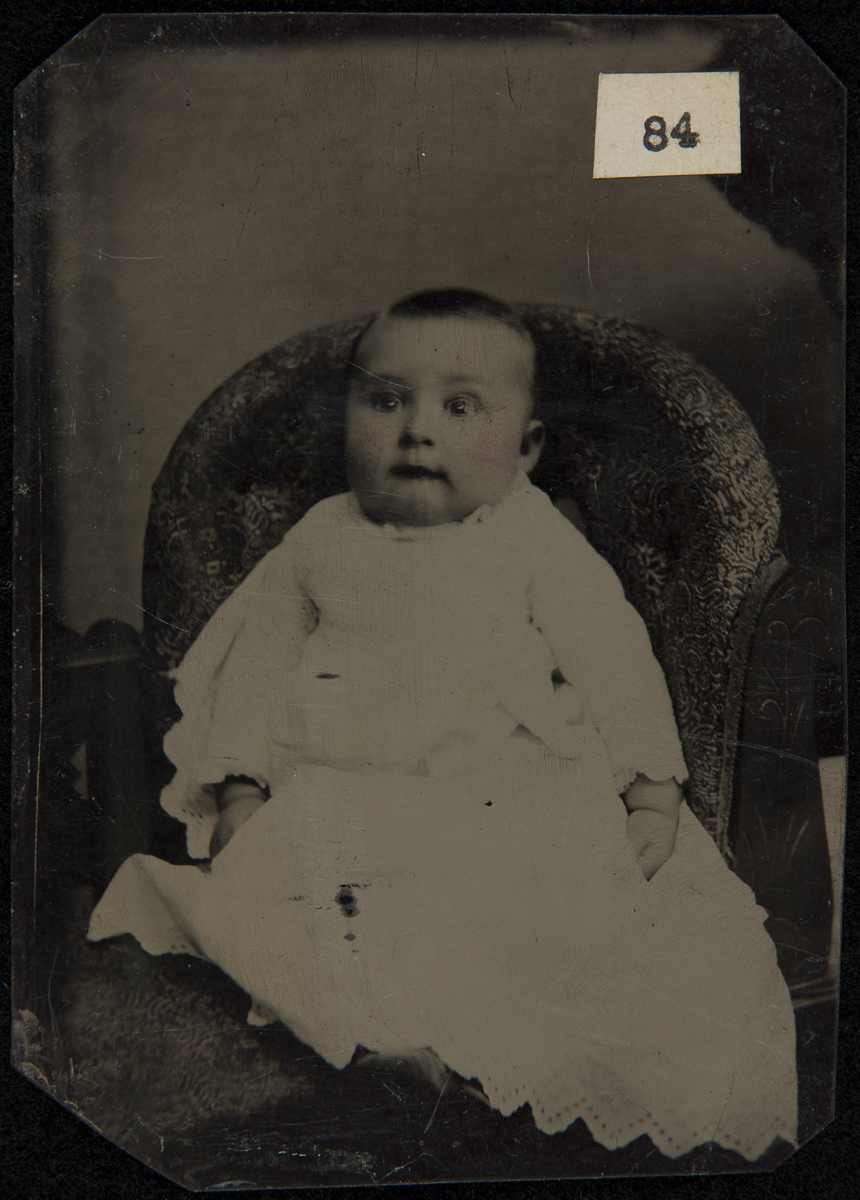 Image of baby in long gown