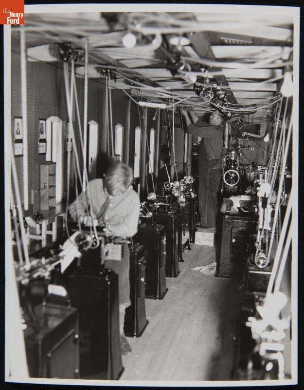 Model of Edison's Menlo Park Machine Shop at Ford Exhibition Building, New York World's Fair, 1939 Boy stands at machine in room full of machines