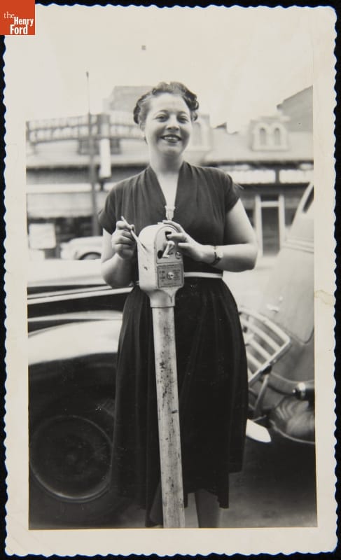 Woman with a Coin-Operated Parking Meter