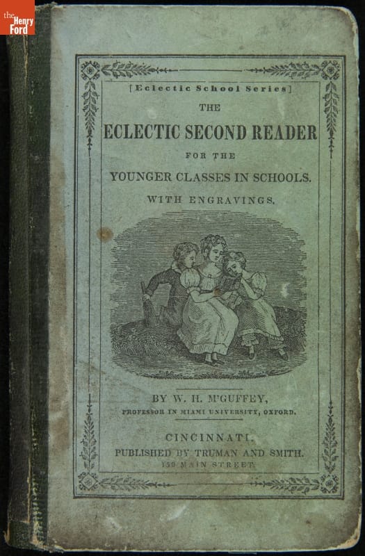 Textbook, "The Eclectic Second Reader," 1836 Blue book cover with image of three people reading a book; also contains text