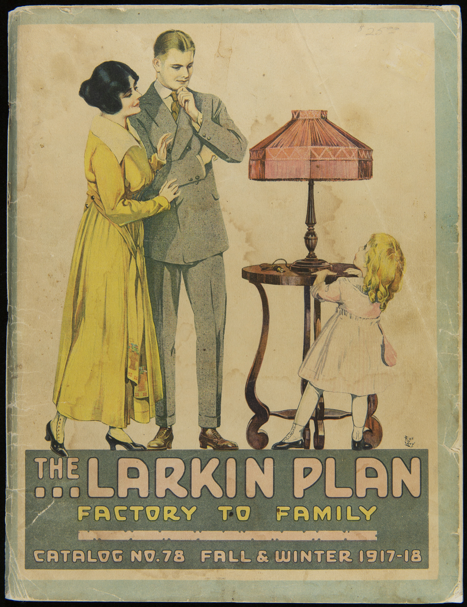 Man, woman, and little girl with table and lamp; also contains text