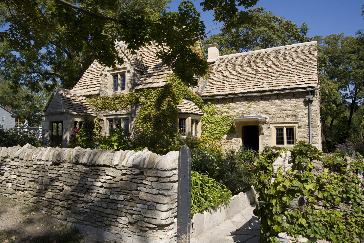 Cotswold Cottage in Greenfield Village, September 2007 Stone house with ivy growing on it, behind stone wall and garden