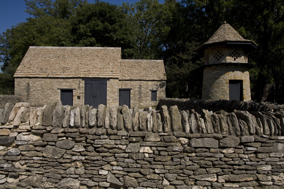 Cotswold Stable and Dovecote in Greenfield Village, September 2007 Stone wall with stone building and stone tower visible behind it