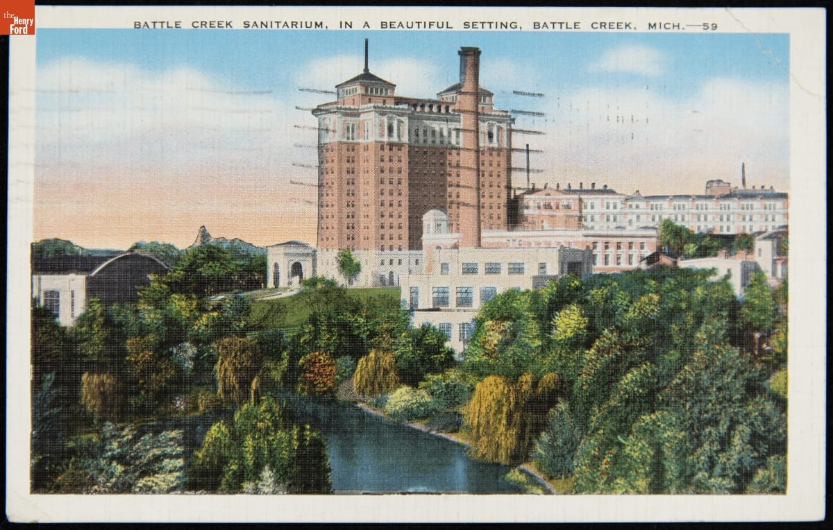 Battle Creek Sanitarium, Battle Creek, Michigan, circa 1938 Large white and red-brick building by water, with trees and foliage in front