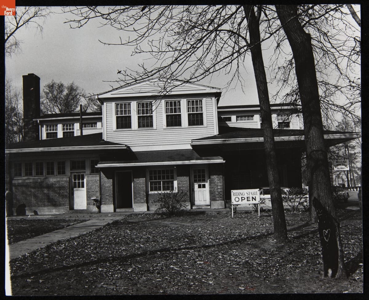 Black-and-white photograph of two-story building