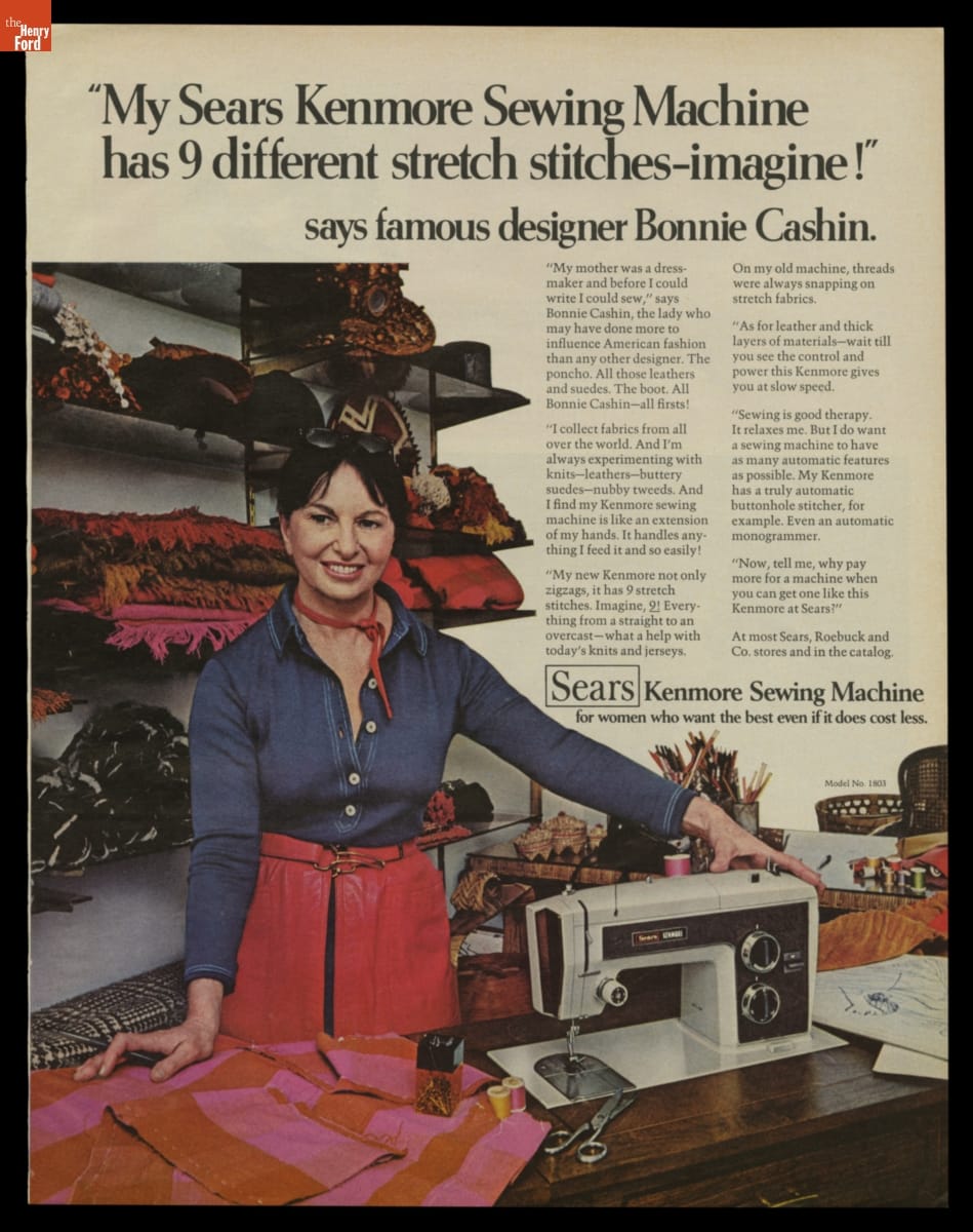 Advertisement for Kenmore Sewing Machines Featuring Designer Bonnie Cashin, 1972 Ad with text and photo of woman in blue denim shirt and red leather pants or skirt standing at table with sewing machine and fabric; more fabric is stacked on shelves behind her
