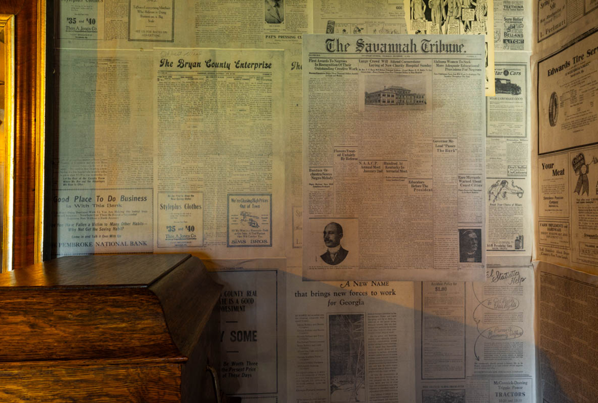 Newspaper covering the walls of a home