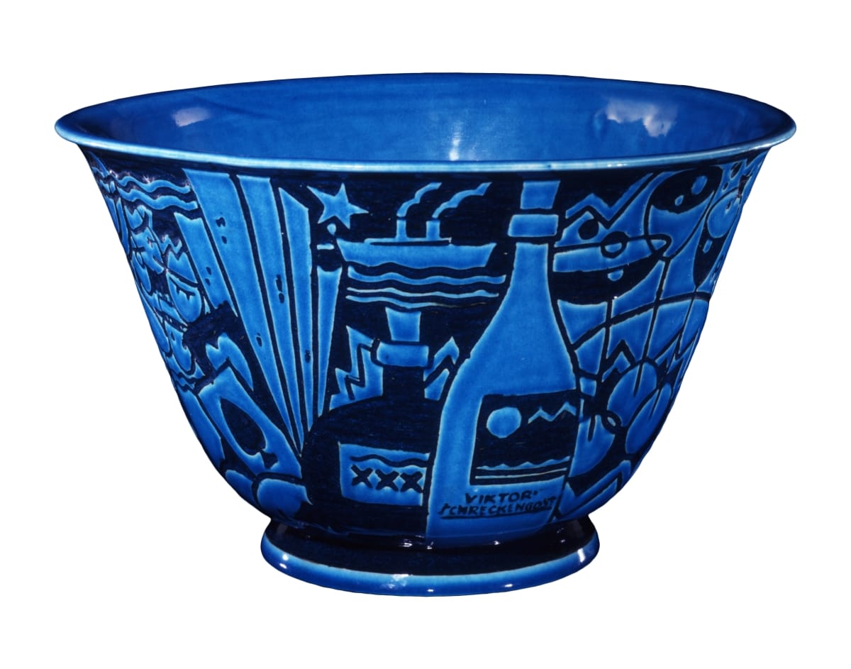 Jazz Bowl, circa 1931 Bowl in two shades of blue depicting a champagne bottle and ship, among other decorative elements