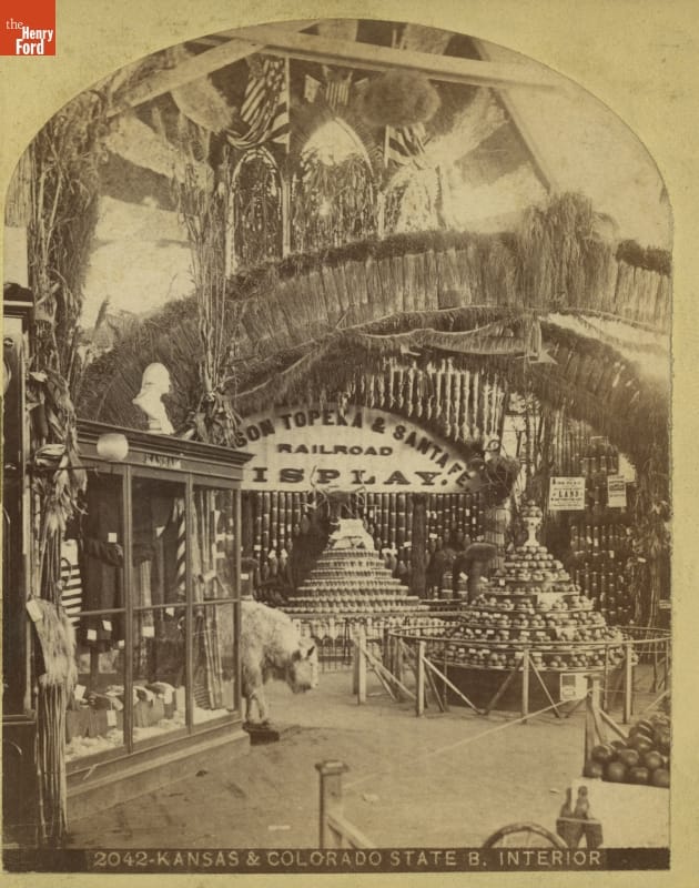 "Kansas & Colorado State Building Interior," Centennial Exhibition, 1876 Elaborate exhibit with cases, stacked items, and taxidermied animals