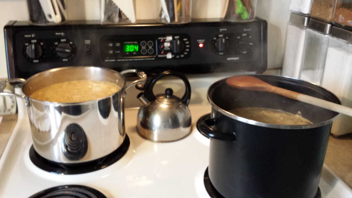 Cooking hoppin' john, 2015 Stovetop with two steaming stockpots filled with soup